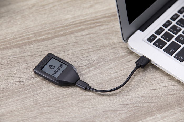 Trezor Model T attached to laptop with a USB cable